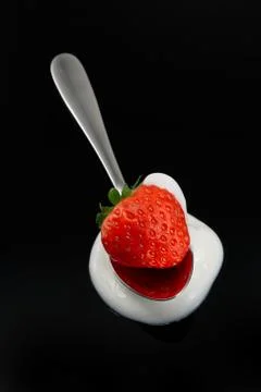 Strawberry on spoon Stock Photos