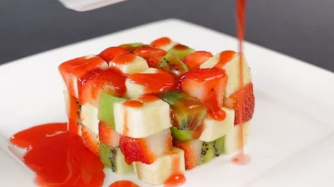 Strawberry Syrup On Fruit Cubes Stock Footage 87957554