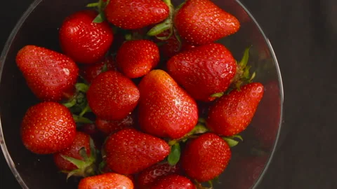 Strawberry top view closeup rotating 360 on black Stock Footage 131161497