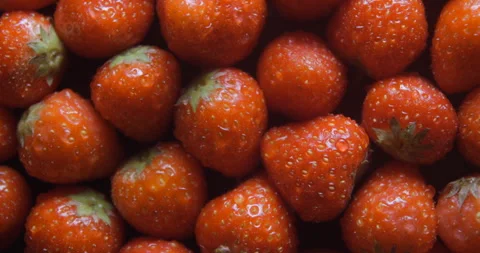 Strawberry with water drops close up studio shot over rotating Stock-Footage 324846843