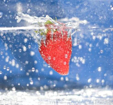 Strawberry In Water Stock Photos