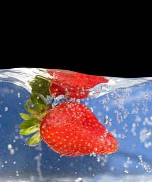 Strawberry In Water Stock Photos