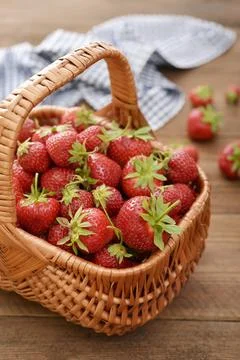 Strawberry in wicker basket Stock Photos