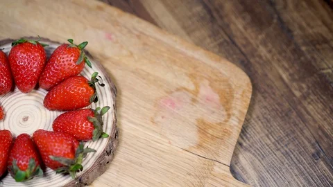 Strawberry on wood slice Video stock 97293502