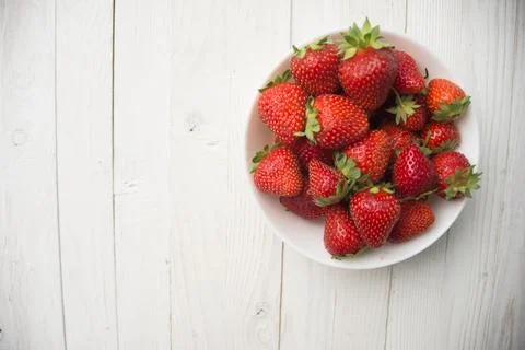 Strawberry on a wooden background Stock Photos