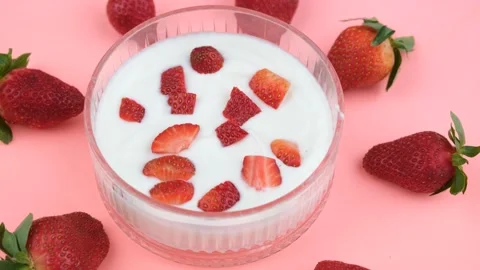 Strawberry yogurt rotating Stock Footage 236191948