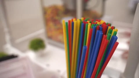 Straws plastic straw drinking disposable rotating background Stock Footage 241093534