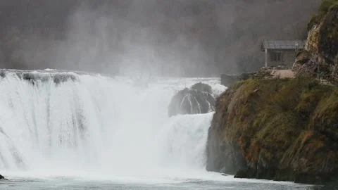 Strbacki buk waterfall on Una river and water mill Stock Footage 297960748