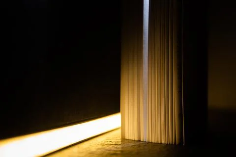Streak of light in a book Stock Photos