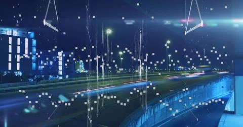Streaking light trails lighting elevated highway at night, with glass building, Fotos de archivo