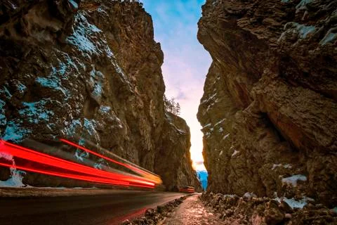 Streaking Lights at Sunset through Canyon Stock Photos