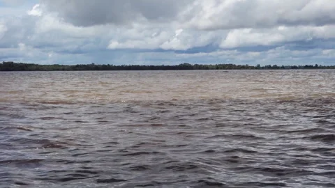 Streaks of water with different colors, junction of Negro river and Amazonas Stock Footage 337139271