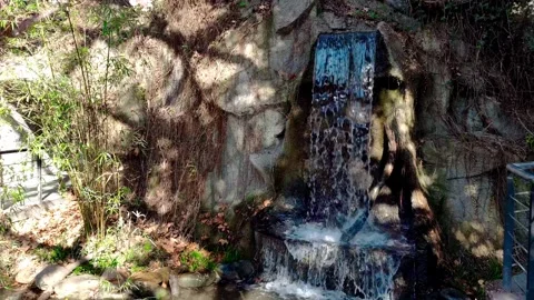 Stream And Small Waterfall In Warm Winter Sun 4K Stock Footage 320921063