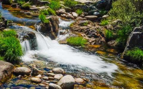 Stream between stones with silk water Stock Photos