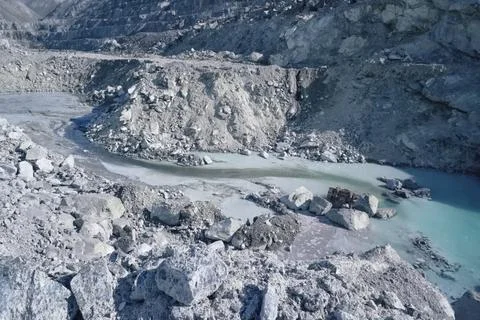 A stream at the bottom of a quarry for the extraction of stone a Stock Photos