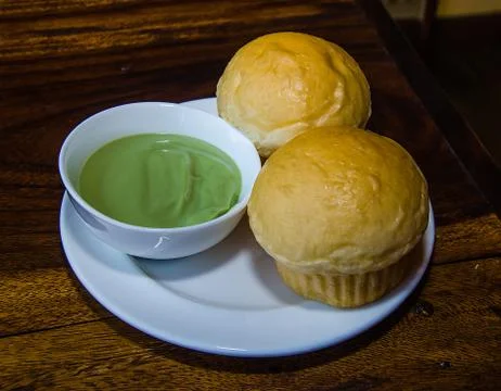 Stream bread dipping with egg custard Stock Photos