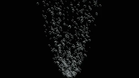 A stream of bubbles rises slowly against a black background. Stock Footage 125999396