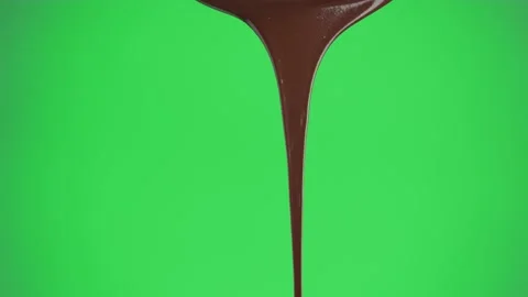 Stream of chocolate pouring on a green screen background, chroma key. Stock Footage 155507178