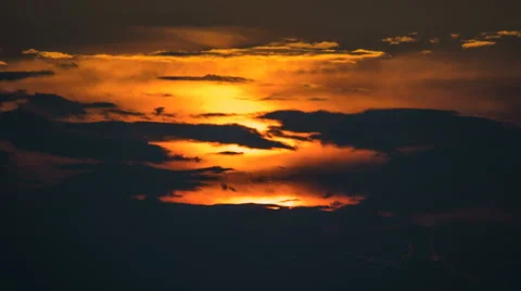 The stream of cloud against the sunset. Time lapse Stock Footage 62942040
