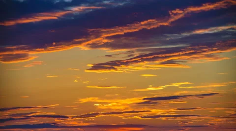 The stream of cloud on the background of sunset. Time lapse Stock Footage