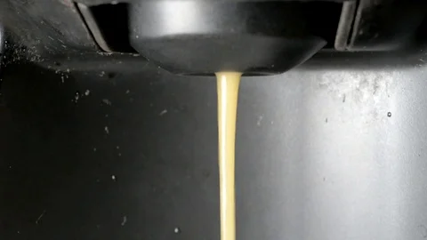 Stream of coffee falling into a cup. tilt Stock Footage 77446284