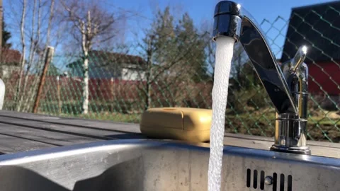 Stream of cold drinking water flows from the tap 库存影片 334061253