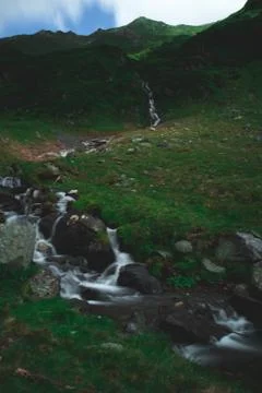 Stream creek falling down the mountain Stock Photos