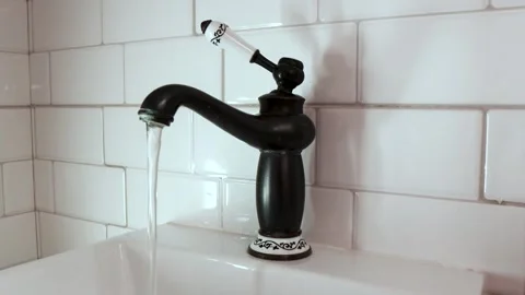 A stream of crystal clear water flows smoothly Stock Footage 330862719