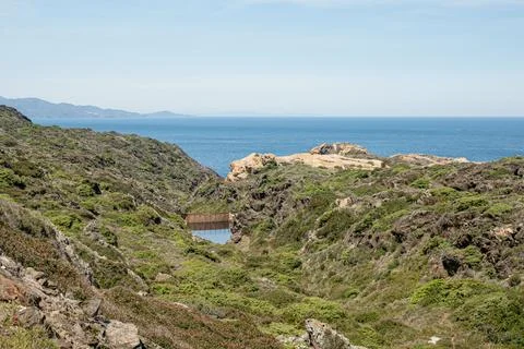 Stream dam in the cliffs. Cap de Creus, Costa Brava, Spain 库存照片