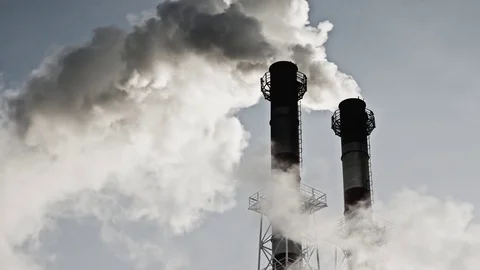 Stream of dark smoke from the chimney of factory Stock Footage