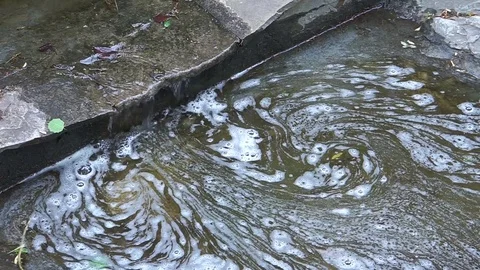 A stream with dirty water. Video stock 76596240