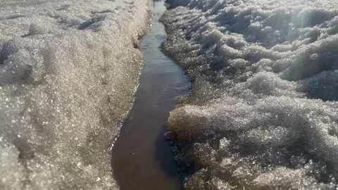 A stream with dirty water, melted snow Stock Footage 151321925
