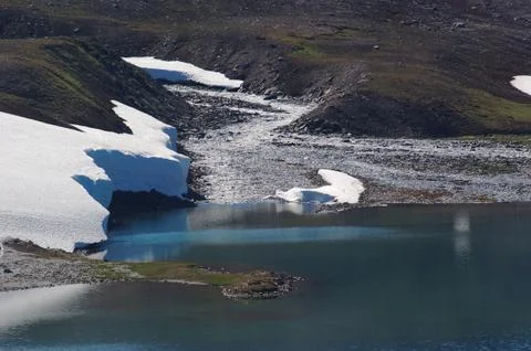 Stream ending in a lake Stock Photos
