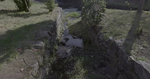 Stream ending in the river, in a local community, Rio de Onor. Portugal. Stock Footage 224312835