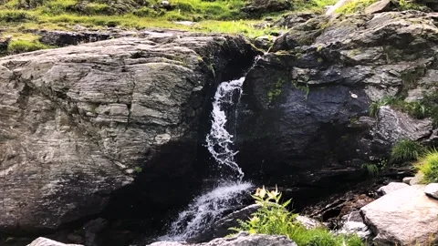 Stream falling water in slow motion - Alpine waterfall Видео 255199105