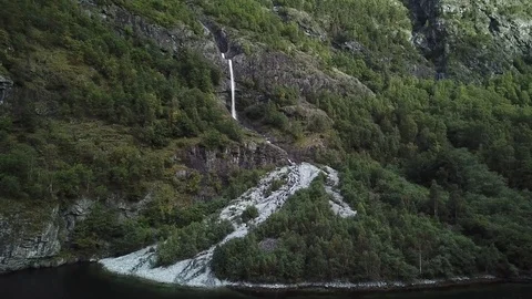 Stream Falls in Several Graceful Leaps, Surrounded by Steep Forested Cliffs Stock Footage 81492253