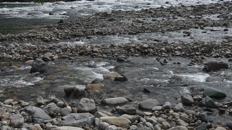 Stream feeding into river Stock Footage 107352715