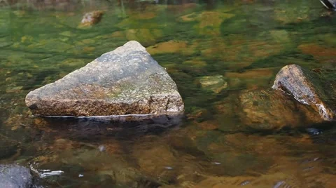 Stream flowing between rocks with authentic sound Stock Footage 52720676