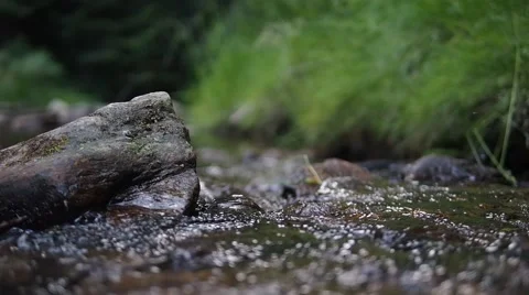 Stream flowing between rocks with authentic sound Stock Footage 52721005
