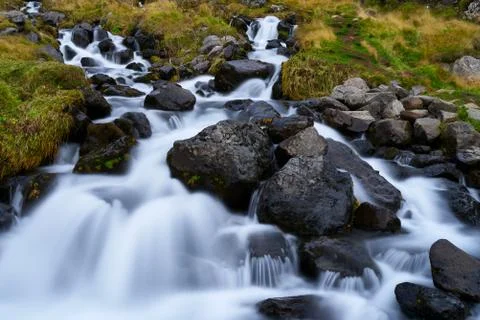 Stream flowing from the Bjarnafoss waterfall Stock Photos