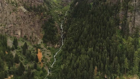 A stream flowing down the side of a mountain Stock Footage 154876325