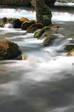 Stream flowing over rocks Stock Photos