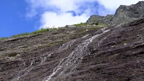 A stream flows down the mountain	 動画素材 278688556