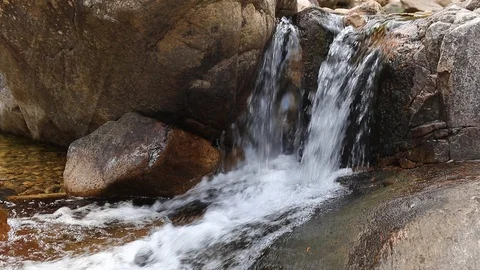 Stream flows on rocks 60fps, could edit head and tail Video stock 88971836