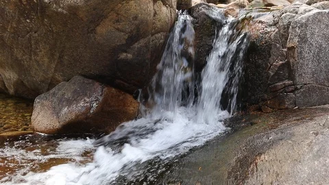 Stream flows on rocks 60fps, could edit head and tail Video stock 88973026