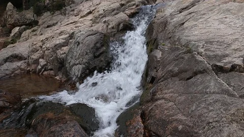 Stream flows on rocks 60fps Video stock 88974452