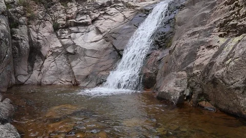 Stream flows on rocks 60fps Video stock 88974469