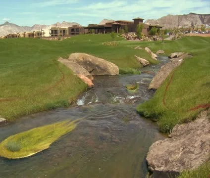 Stream flows through golf course Stock Footage 21678387