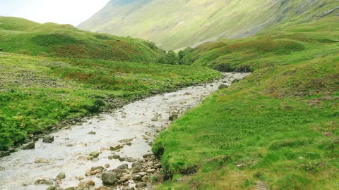 The stream flows through a mountain valley. Scotland. Stock Footage 86731005
