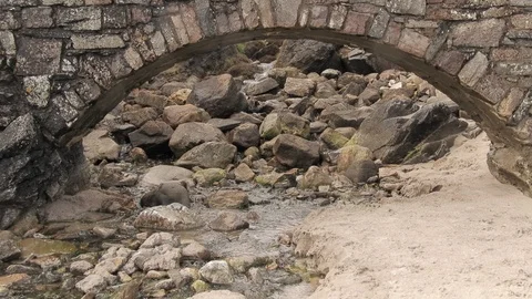 Stream flows under a stone bridge 4K- Scotland Durness Video stock 94870850